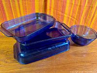 Stacked cobalt blue Pyrex dishes and separate mixing bowl