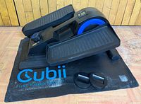 Top view of Cubii F3A2 elliptical on included mat with wheel stoppers visible
