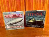 Front view of both books standing upright