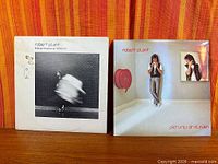 Both album covers side by side