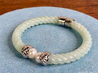 Full view of bangle showing jade, sterling clasp and pearl ends