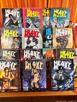 12 Heavy Metal magazines on rack, showing covers