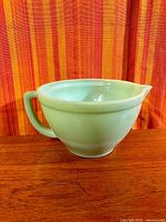 Full view of jadeite mixing bowl showing shape and spout