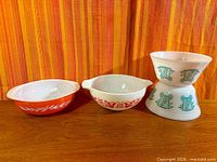 Group shot of four vintage Pyrex milk glass mixing bowls