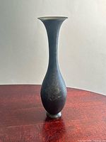 Full view of bronze vase on table
