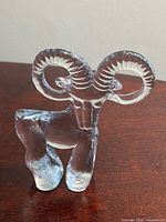Front view showing clear glass goat with sculpted details
