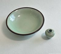 Top view of green shallow dish and miniature vase