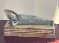 Front angle of reclining Buddha on base