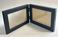 Frame open showing both photo openings and hinge