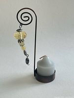 Full view tealight holder with candle and beads