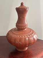 Full view of terracotta water vase front profile