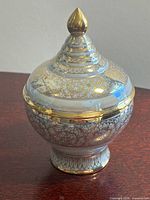 Full view of porcelain jar with lid on