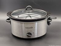 Front view of stainless steel Crock-Pot with glass lid