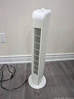 Full view of Digimark white tower fan with cord