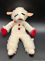 Front view of Lamb Chop puppet showing overall appearance and tags