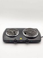 Front view showing both burners, knobs and indicators