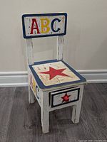 Front view of chair showing ABC backrest, star seat, drawer