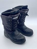 Front angled view of both boots showing overall design and condition