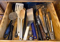 Drawer showing full assortment of utensils