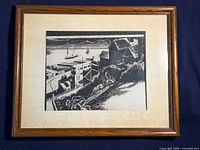 Front view of framed black-and-white woodblock print showing artwork, mat and frame