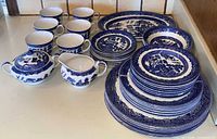 Full dinnerware set stacked showing all piece types