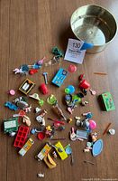 All miniature items spread out on table with bowl beside