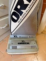 Front view of Oreck XL2600HH upright vacuum showing base, XL branding, and cloth bag