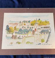 Overall view of matted, signed village print in clip frame