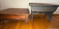Both wooden foot stools side by side showing size and style differences