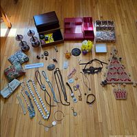 Full layout showing jewelry boxes, organizers, stands, costume jewelry spread out