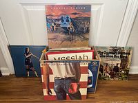 Box of records showing 38 Special, Born in the U.S.A., Messiah, Chambers Brothers plus other spines