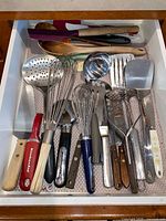 Drawer view of full assortment of utensils