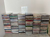 Full front view of stacked CDs showing quantity