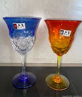 Front view of both Ryukyu glass goblets showing colors and design