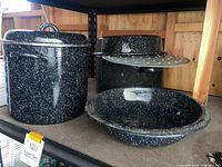 All three enamelware pieces grouped on shelf