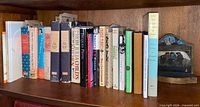 Full shelf showing cookbooks and single bookend
