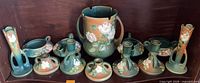 Group shot of entire Roseville White Rose pottery lot