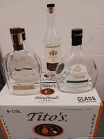 Front view showing five bottles on Tito's case