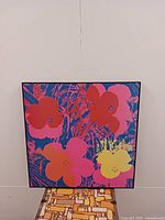 Front view showing multicolor Flowers print within black frame