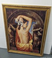 Full view of framed canvas art leaning against wall