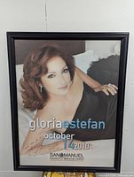 Front view of framed signed Gloria Estefan concert poster