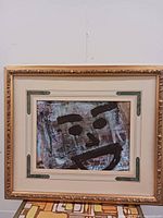 Front view of one framed artwork showing motif, matting and frame