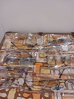 Front view of 12 sunglasses in individual plastic sleeves