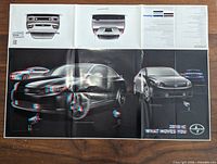 Fold-out poster showing Scion tC exterior with rear views, spec panel and 3-D styled images