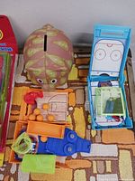 Closer view of turtle bank, basketball game, hockey game