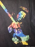 Front view of Jimi Hendrix black t-shirt with rainbow graphic