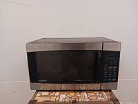 Front view of GoldStar microwave showing stainless steel door, control panel and overall condition