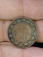 Reverse showing ONE CENT CANADA 1920 within maple leaf wreath
