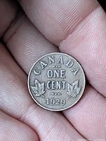 Reverse of 1929 Canada one cent coin showing denomination, country, date, maple leaves