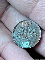 Reverse showing maple leaf design, denomination and date 1940